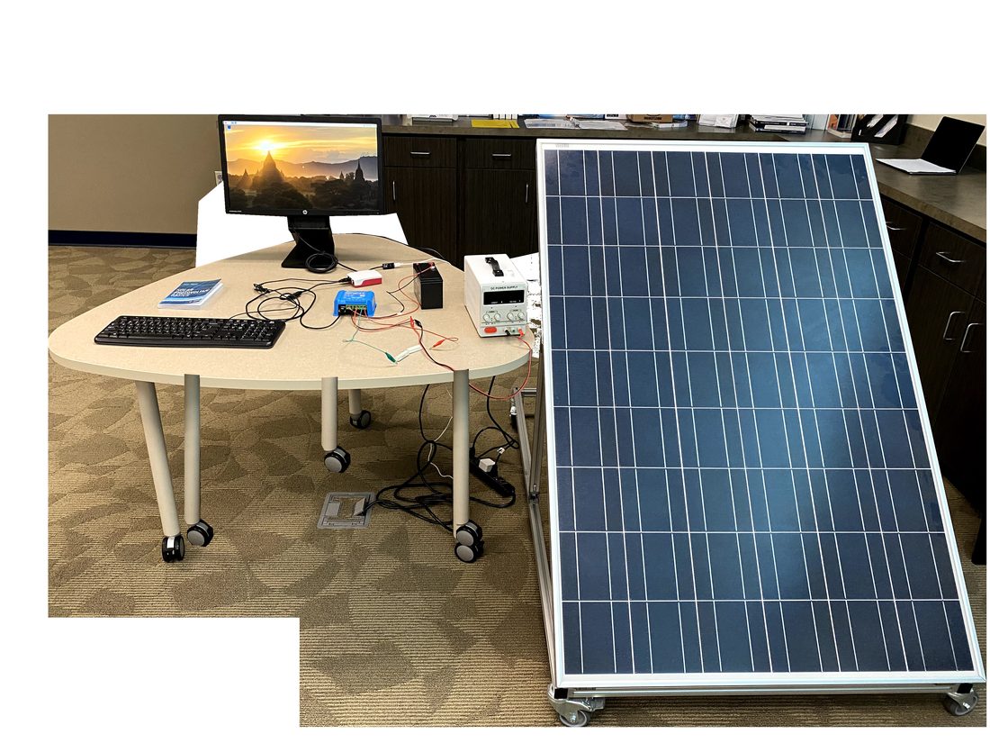 E3 OSE classroom lab station with solar panel, charge controller, and monitoring workstation